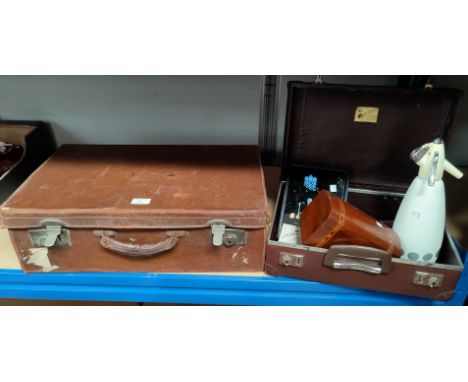 An old leather suitcase; a smaller suitcase; a 19th century walnut and Tunbridgeware tea caddy; a 1930's butterfly wing tray;
