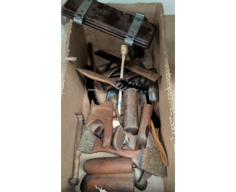 A selection of 19th century and later boxwood hat making tools; brushes tie press etc 