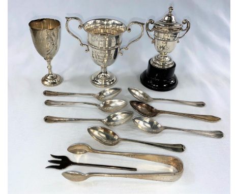 A set of 6 silver coffee spoons, Sheffield 1938; a pair of silver sugar tongs; 3 hallmarked silver trophy cups, various dates