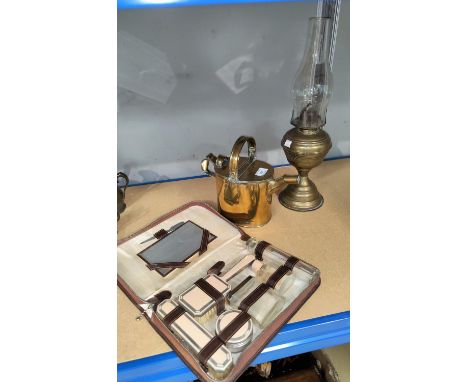 A 1930's ladies fitted overnight case; a brass hot water jug and oil lamp 