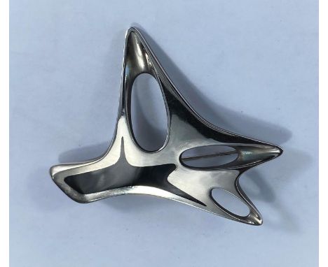 Georg Jensen, a silver brooch designed by Henning Koppel of modernist pierced abstract form and black enamel decoration, stam