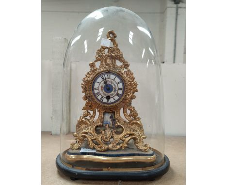 A 19th century French mantel clock in porcelain and gilt metal rococo style case, with drum movement striking on bell, height