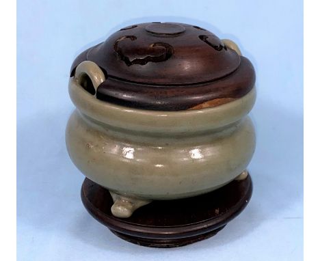 A Chinese celedon glaze tripod censor with carved wooden cover fitted over two handles height 10.5cm 