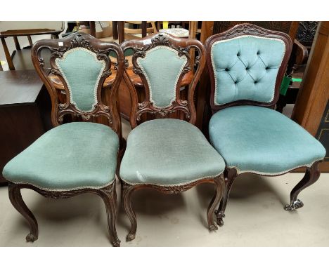 An Edwardian set of 3 carved rosewood dining chairs reupholstered in light blue dralon; a similar chair 