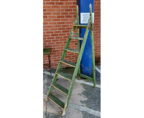 A vintage A-frame decorators ladder in green finish (decorative purposes only) 