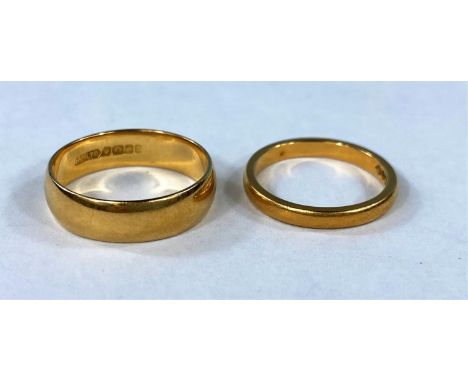 Two 22ct hallmarked gold rings 8gm.  The larger one is size O and the other size K 