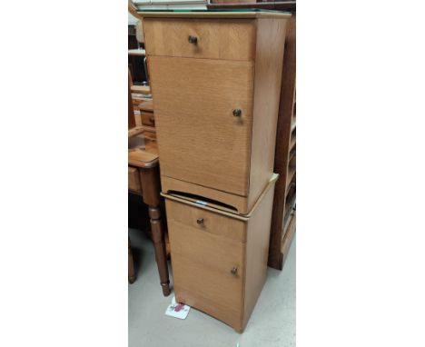 A 1950's pair of light oak bedside cabinets by 'Uniflex' 