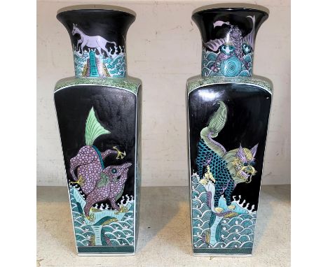 A pair of Chinese famille verte vases with squared bodies, various mythical sea creatures to the four sides and rim with blac