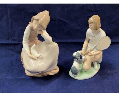 Two Nao groups:  kneeling girl with puppy, height 23.5 cm &amp; seated girl with dove, height 25 cm 