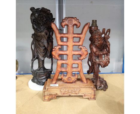 A Chinese carved hardwood character on stand, height 40cm. 2 carved Chinese wooden figures, one inlayed with metal, height 46