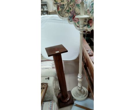 A turned and fluted torchère with square top; a standard lamp in silvered and cream finish 