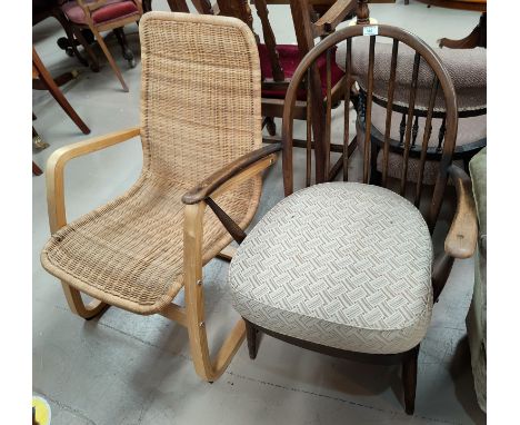 An Ercol style armchair with hoop and stick back; a lightwood and cane armchair 