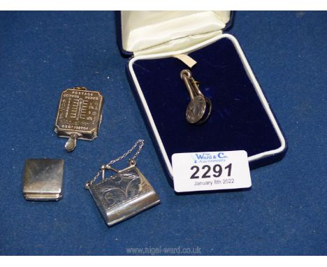 A cased Silver napkin clip, Birmingham 1907 by C.E. Williams, plus a small silver purse London 1948 by Ari Norman, a white me