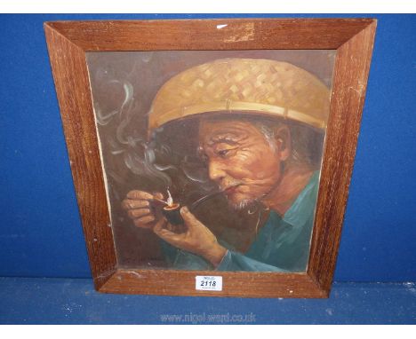 A wooden framed Oil on canvas depicting an oriental gentleman lighting his pipe, signed lower left P.C. Chan, 13 1/2" x 15 1/