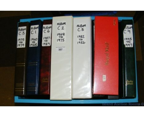 A box containing GB stamps in eight albums, First Day Covers and presentation packs