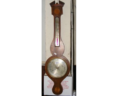 A barometer/thermometer with inlaid decoration