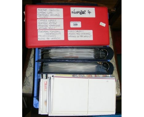 A box containing First Day Covers, year packs and stamp books