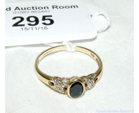 A 9ct gold diamond and onyx ring