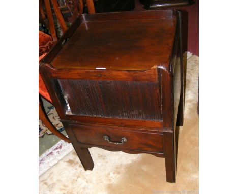 A Georgian mahogany commode with tambour front