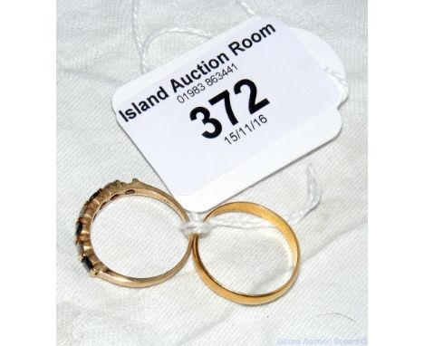 A 22ct gold wedding band, together with one other ring