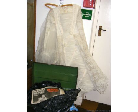 Metal trunk containing interesting old newspapers and ephemera, together with an old wedding dress