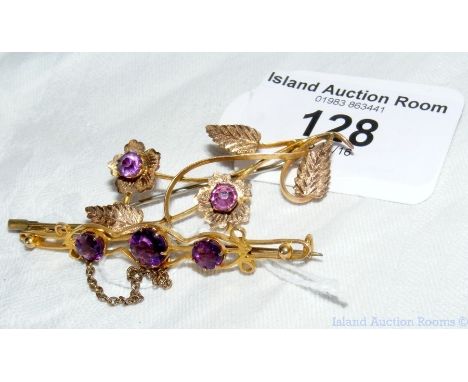 An old brooch with amethyst mount and one other