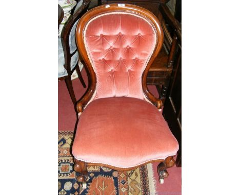 A Victorian nursing chair with button back