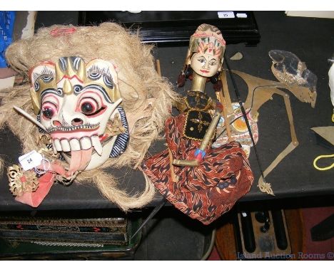An Indonesian leather puppet and mask