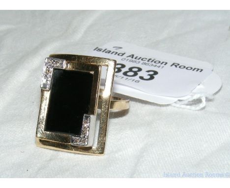 Black onyx and diamond ring in 14ct gold setting