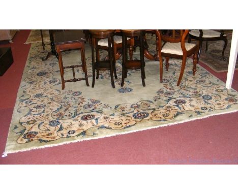 Chinese style carpet with floral border and centre medallion