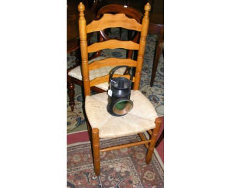A railway lamp together with a rush seated ladder back chair