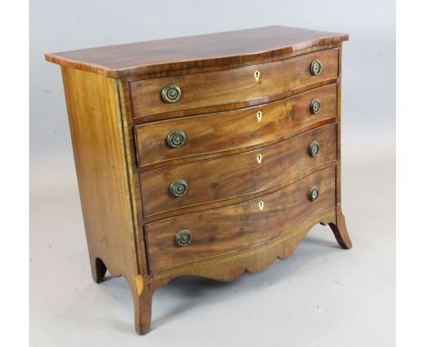 A George III inlaid mahogany serpentine chest, of four graduated long drawers, on swept bracket feet, W.3ft 3in. D.1ft 9in. H