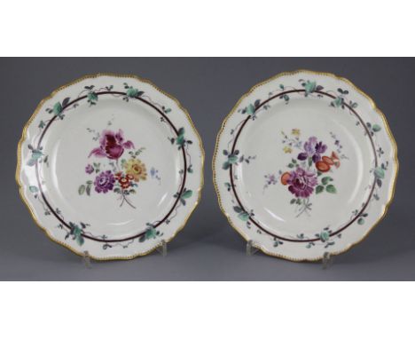 A pair of Worcester Sheridan pattern plates, c.1770, painted in the London studio of James Giles with flower sprays within vi