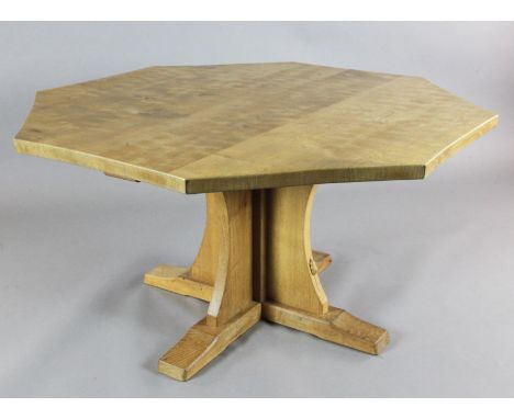 A Robert 'Mouseman' Thompson oak octagonal centre table, with saltire pillar and trestle feet, a mouse carved to one side of 