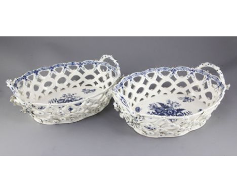 A pair of unusually large Worcester blue and white pine cone pattern baskets, c.1775, each applied with flowers, shaded cresc