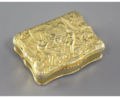 An early 19th century Scottish? silver gilt snuff box, of rectangular serpentine form, the lid decorated with classical scene