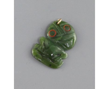 A Maori nephrite jade tiki pendant, the stylised eyes , 1.6ins