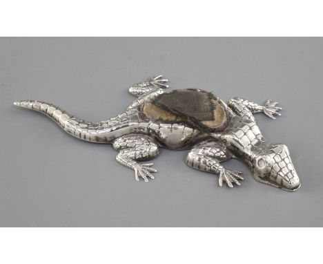 An Edwardian novelty silver pin cushion modelled as a lizard by Crisford & Norris, Birmingham, 1909, (pad a.f. and eyes missi