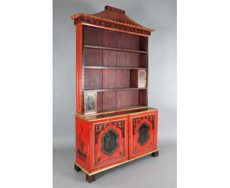 A Chinese Chippendale style red lacquered bookcase, with pagoda pediment, open shelves and panelled doors, on bracket feet, W