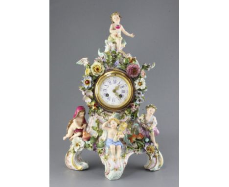 A large Meissen figural mantel clock, late 19th century, of cartouche shape and encrusted with flowers and modelled with four