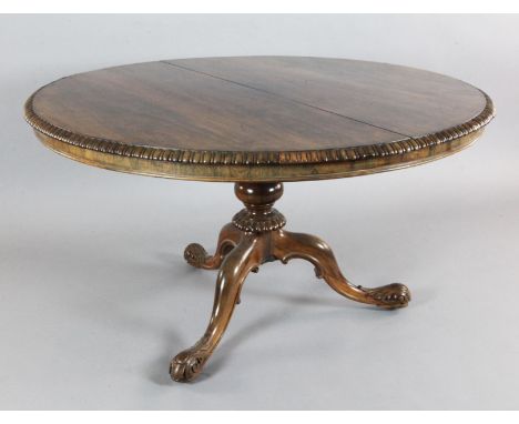 An early Victorian rosewood breakfast table, by Gillows, with circular tilt top, on fluted baluster stem and carved tripod ba