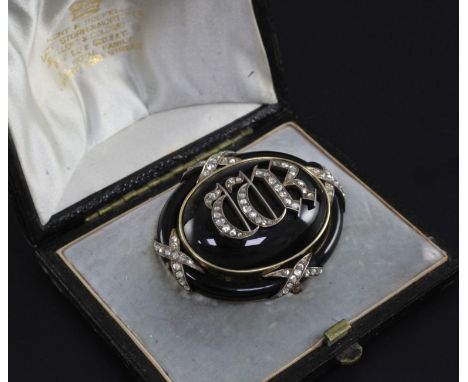 A Victorian gold, black enamel and rose cut diamond mourning pendant brooch in Hunt & Roskell fitted box, of oval form, set w