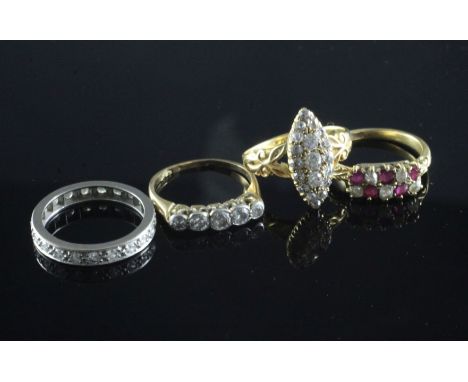 Four 18ct gold gem set rings including diamond cluster, ruby & diamond and a diamond full eternity, various sizes.