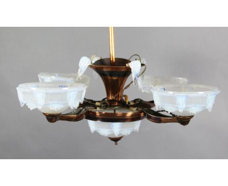 An early 20th century French coppered metal light fitting, with opalescent glass shades, drop 2ft, Diam. 2ft 6in.
