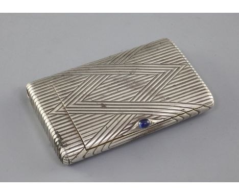 A late 19th/early 20th century Russian 84 zolotnik silver cigarette case, with stylised reeded decoration and cabochon sapphi