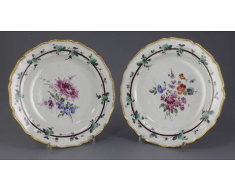 A pair of Worcester Sheridan pattern plates, c.1770, painted in the London studio of James Giles with flower sprays within vi
