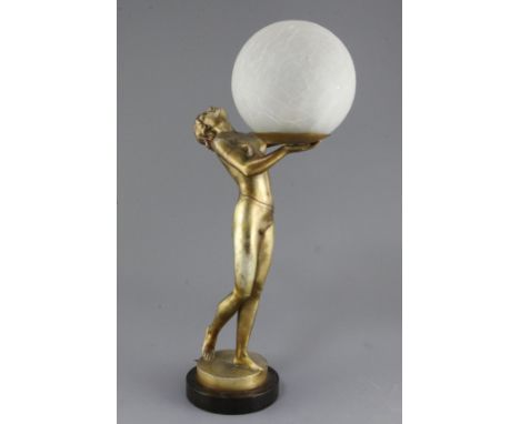 An Art Deco bronzed spelter table lamp, modelled as a maiden holding a globe, 20in.