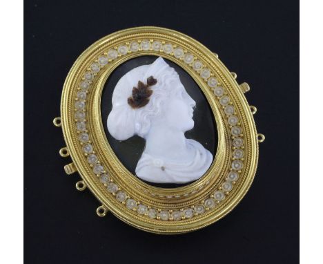 A Victorian gold, white enamel and hardstone cameo oval choker clasp, with cannetile and ropetwist border and carved with the