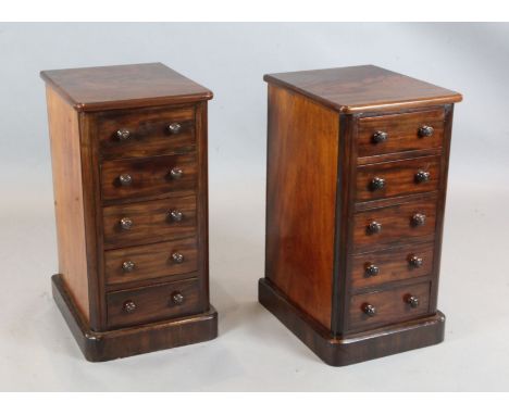 A pair of Victorian mahogany pillar chests, fitted five drawers, W.1ft 4in. D.1ft 6in. H.2ft 6in.