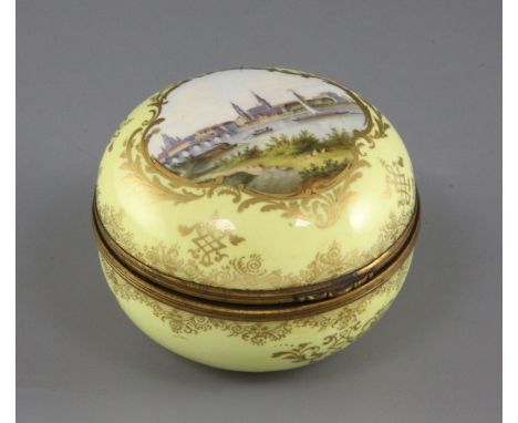 A Meissen yellow ground trinket box and cover, 19th century, painted with a titled view of Dresden, underglaze blue cross swo